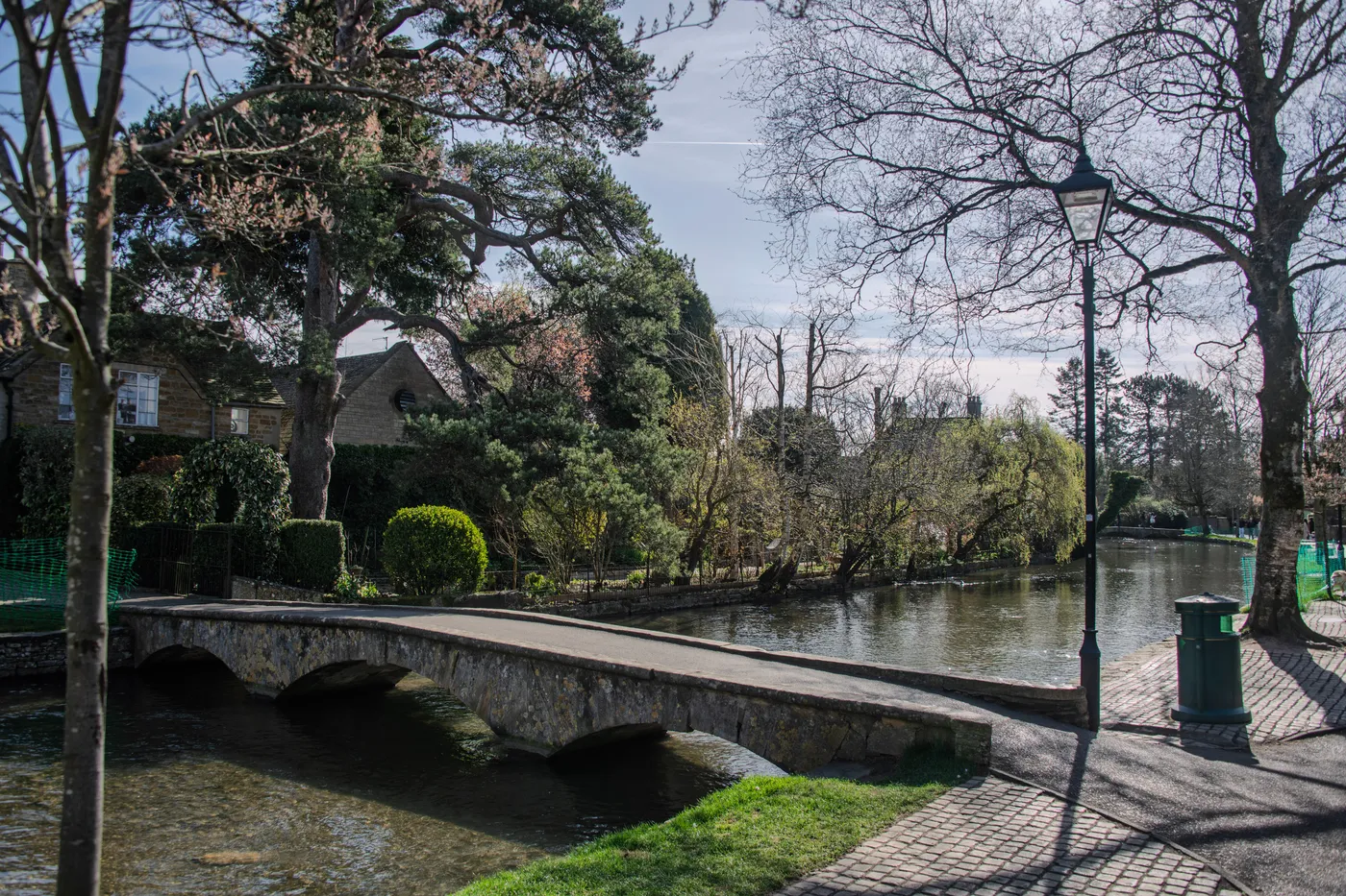 Low stone footbridges over the River Windrush in Bourton-on-the-Water