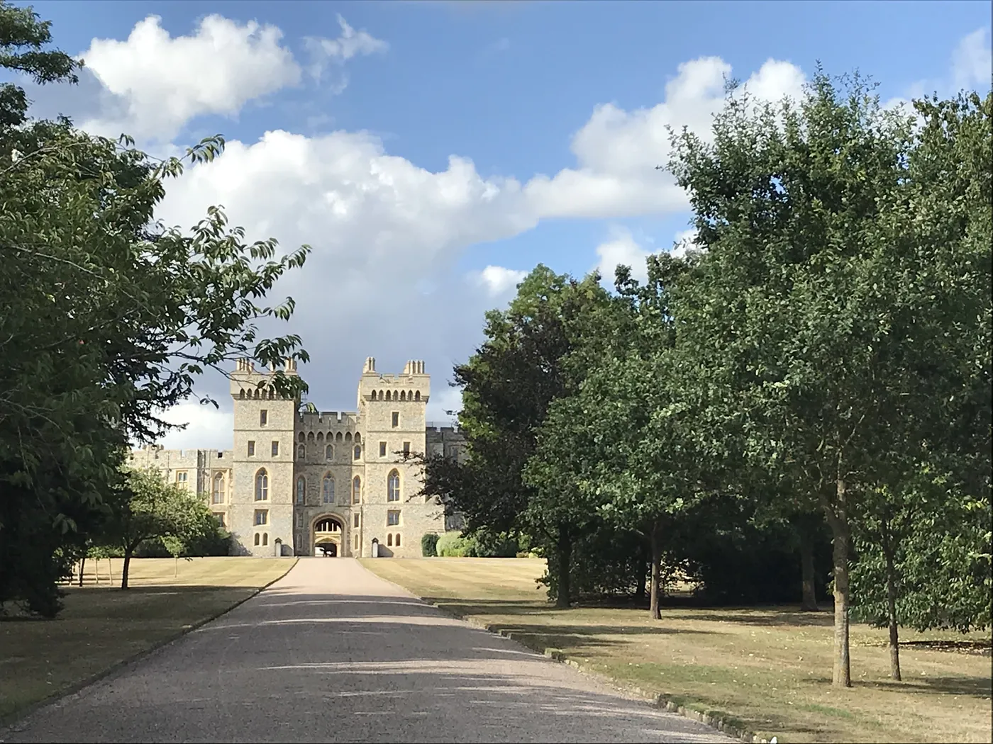 Tree-lined Long Walk leading to the gatehouse towers of Windsor Castle